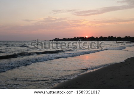 Dramatic colorful seaside sunset summer New England beach landscape