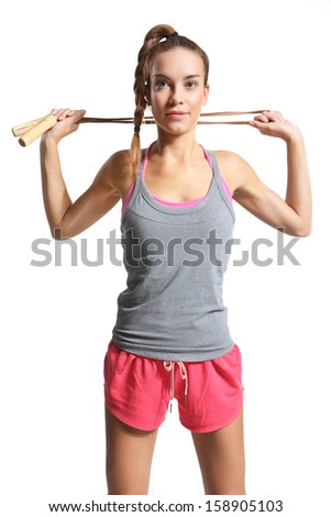  shapely woman exercising with a jump rope