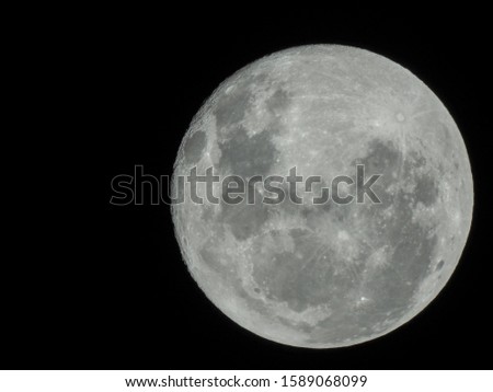 Picture of the moon across night sky