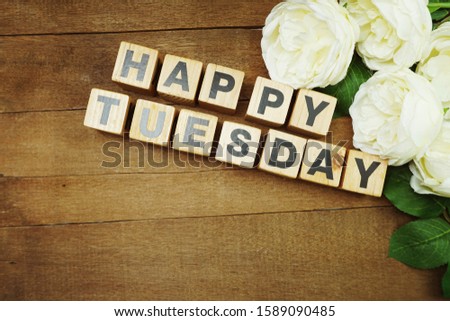Happy Tuesday text alphabet letter on wooden background