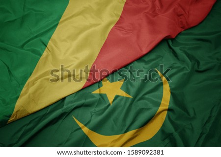 waving colorful flag of mauritania and national flag of republic of the congo. macro