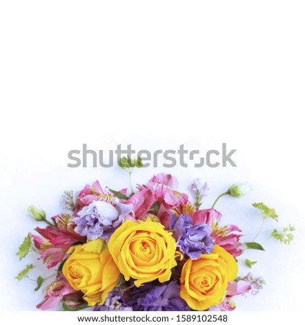 Festive floral arrangement in bright colors. Multicolored flowers on a white background. Astromeria and roses in an elegant bouquet. Background for greetings, invitations, cards for wedding, birthday.
