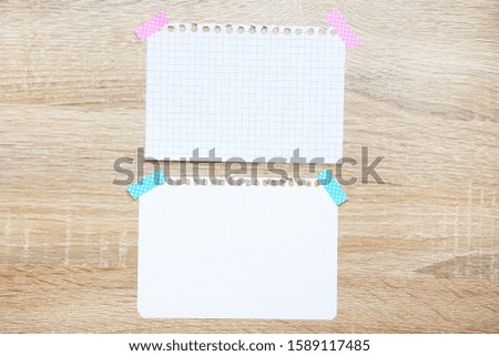 Blank sheets of paper on brown wooden table
