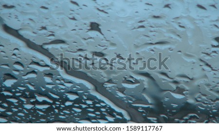 drops of water on glass in the daytime