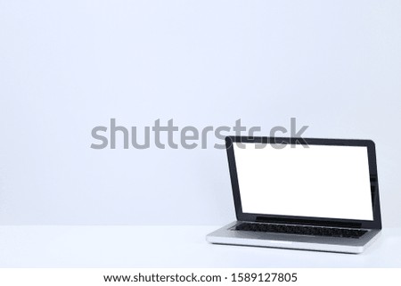 Laptop computer on grey background