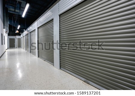 Storage facilities with gray doors. Moving, storage concept. Royalty-Free Stock Photo #1589137201