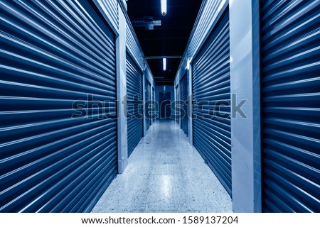 Hallway with blue storage units. Blue phantom colors Royalty-Free Stock Photo #1589137204