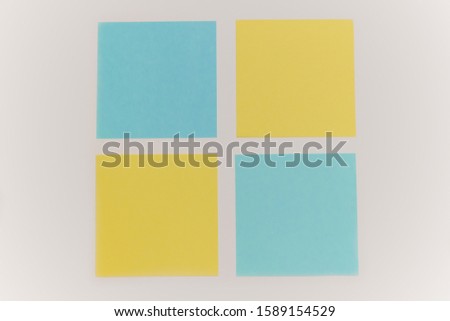 Blue and yellow paper stickers isolated on white background
