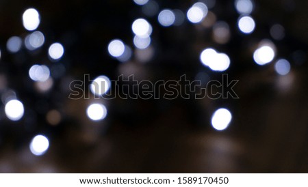 Abstract light, bokeh effect, new year lights. Dark background, bokeh light.