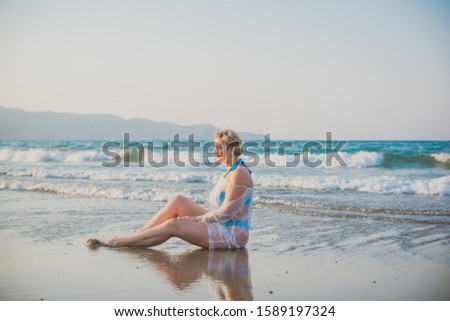 Pretty plus size nice young woman rest at sea, vacation and trip concept