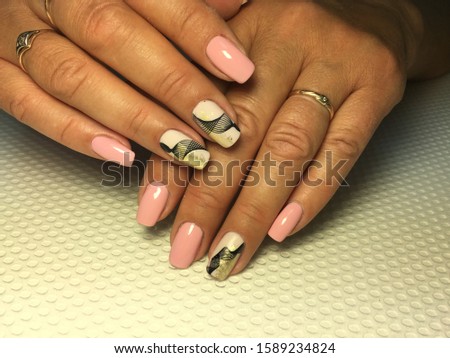 fashion pink manicure with a stylish matte design and black
