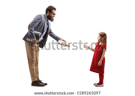 Full length profile shot of a male teacher giving a book to a girl isolated on white background
