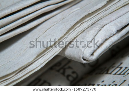 Macro shots folded a newspaper closeup picture