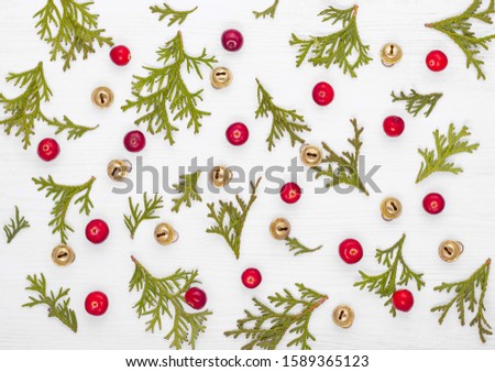 Christmas card. Christmas greeting layout template with fir branches and red berries. Christmas card on wooden background. Christmas background. Xmas. Happy New Year. Copy space.