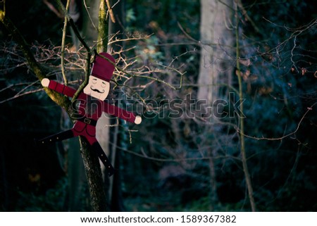 Funny and colorful wooden Christmas figure in the park