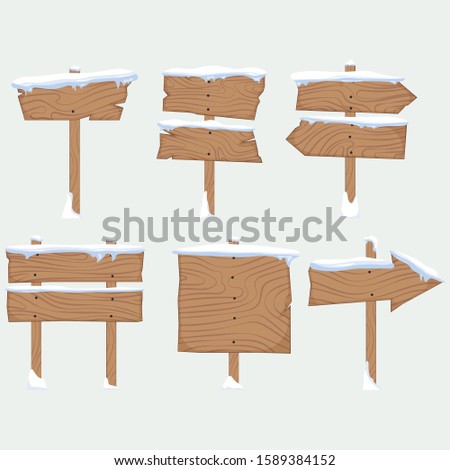 Wooden cartoon signs with snow cap. Wooden pointers. Direction signs. Signboards. Vector.