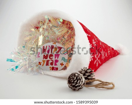 Christmas tree toy on the background of artificial snow and green pine branches  