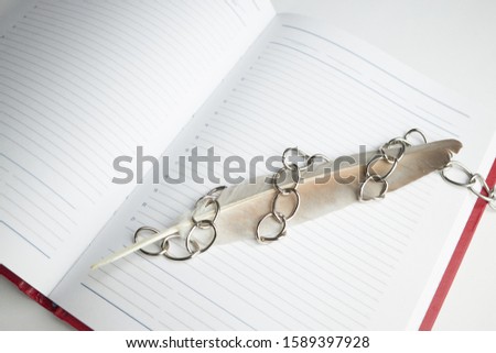 red empty book or diary in chains. information security concept. top view.