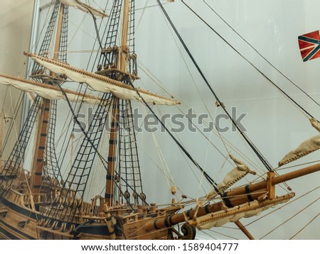 vintage wooden ship sailboat in the sea layout