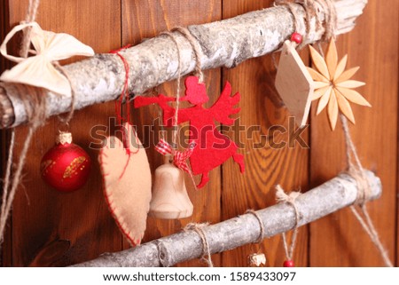 Christmas composition. Garland made of red balls and fir tree branches. Christmas, winter, new year concept.