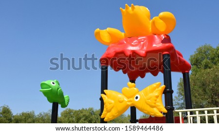 Children's toys made of brightly colored plastic in the playground