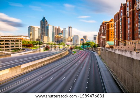 Atlanta, Georgia, USA downtown skyline over the highways at dusk.