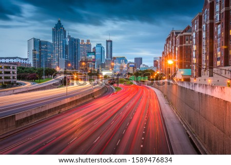 Atlanta, Georgia, USA downtown skyline over the highways at dusk.