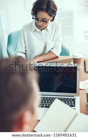 Female employee is very busy in the office stock photo