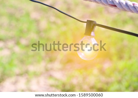 Light bulb and blurred background, Cafe background, Holidays background.
