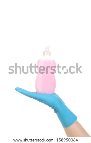 Bottle on a hand in gloves. Isolated on a white background.