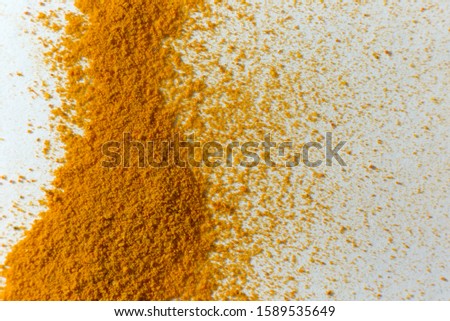 Ground turmeric. Spice orange powder on a white background.