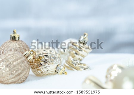 Christmas ball and Snowflakes on snow, Winter holidays concept. White and Golden Snowflakes decorations In Snow Background