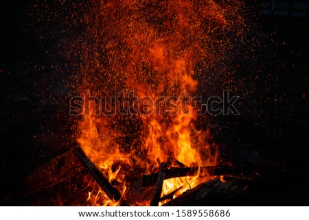 Billion rising sparks from a powerful bonfire, colorful space effect