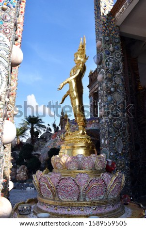  A beautiful golden Buddha statue was placed in front of the temple (wat pa-chon-kaew in Thai words) at  Khao Kho,Phetchabun,Thailand.