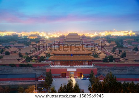 Aerial bird view of the architecture building and decoration of the Forbidden City at night in Beijing, China. Asian tourism, history building, or tradition culture and travel concept
