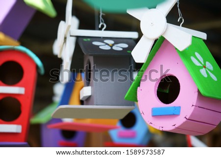 close up of beautiful colored wooden bird house