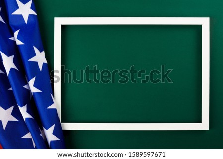 President's Day Concept, flat lay top view, America Flag and photo frame on Olive green background with copy space for your text