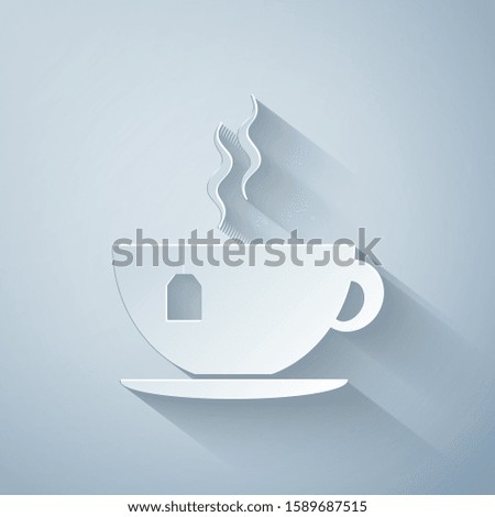 Paper cut Cup with tea bag icon isolated on grey background. Paper art style