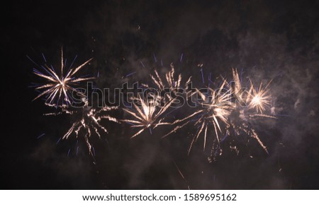 Sparkling white coloured fireworks at a dark sky