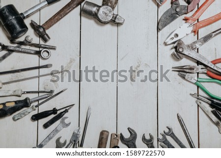 construction hammers screwdriver repair tool pliers on the board