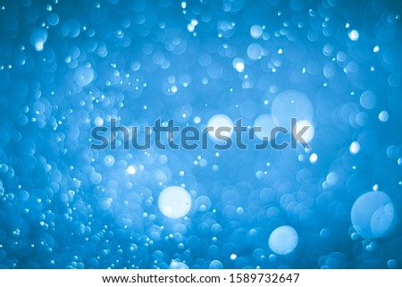 Abstract bokeh lights with light Blue background,
