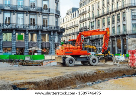 Central street with excavators working at renovation of road in downtown, Brussels, Belgium