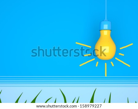 Yellow light bulb on blue background with grass.