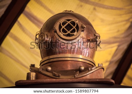 Old antique metal scuba helmet with clipping path isolated on white background