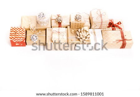Gift or present boxes and stars confetti on white table top view. Flat lay composition for birthday, christmas or wedding.