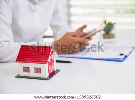 women using calculator to count rent, Calculating mortgage, loan or investment.Buying and selling houses and real estate prices concept.