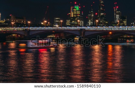 Long exposure shot of London skyline at night (Thames, Blackfriars Bridge and financial district in the background)