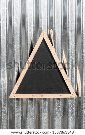 Blackboard Triangle Shape hanging on Zinc Sheet,copy space