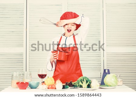 Girl in apron whipping eggs or cream. Start slowly whisking or beating cream. Confectionery and patisserie. Whipping cream tips and tricks. Butter cream. Use hand whisk. Woman chef hold whisk and pot.