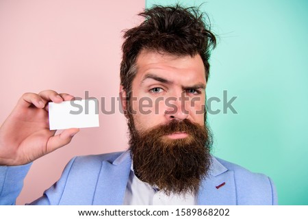 Banking services. confident businessman. blank piece of paper. barbershop concept. best barber master. barber shop for gentlemen. brutal male beauty. serious bearded man business card. copy space.